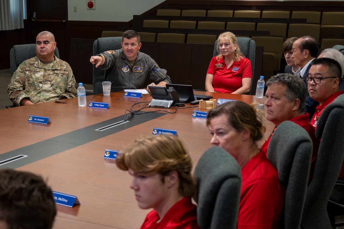 35th Fighter Wing leadership sits down with Misawa City mayor Yoshinori Kohiyama and members of the Wenatchee Valley sister city delegation during a presentation at Misawa Air Base, Japan, Oct. 3, 2025. Delegates from Wenatchee visit Misawa City annually, highlighting the legacy of community relations initiated by the historic Miss Veedol flight in 1931, the first non-stop flight across the Pacific Ocean starting at Sabishiro Beach, Misawa and landing in East Wenatchee. (U.S. Air Force photo by Senior Airman Patrick Boyle)