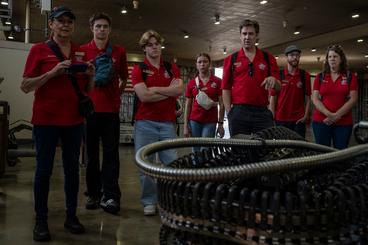 Members of the Wenatchee Valley, Washington sister city delegation look at F-16 Fighting Falcon components at Misawa Air Base, Japan, Oct. 3, 2025. The visit strengthened the long-standing sister-city partnership between Wenatchee Valley and Misawa, reinforcing community bonds that support U.S.–Japan cooperation in northern Japan. (U.S. Air Force photo by Senior Airman Patrick Boyle)