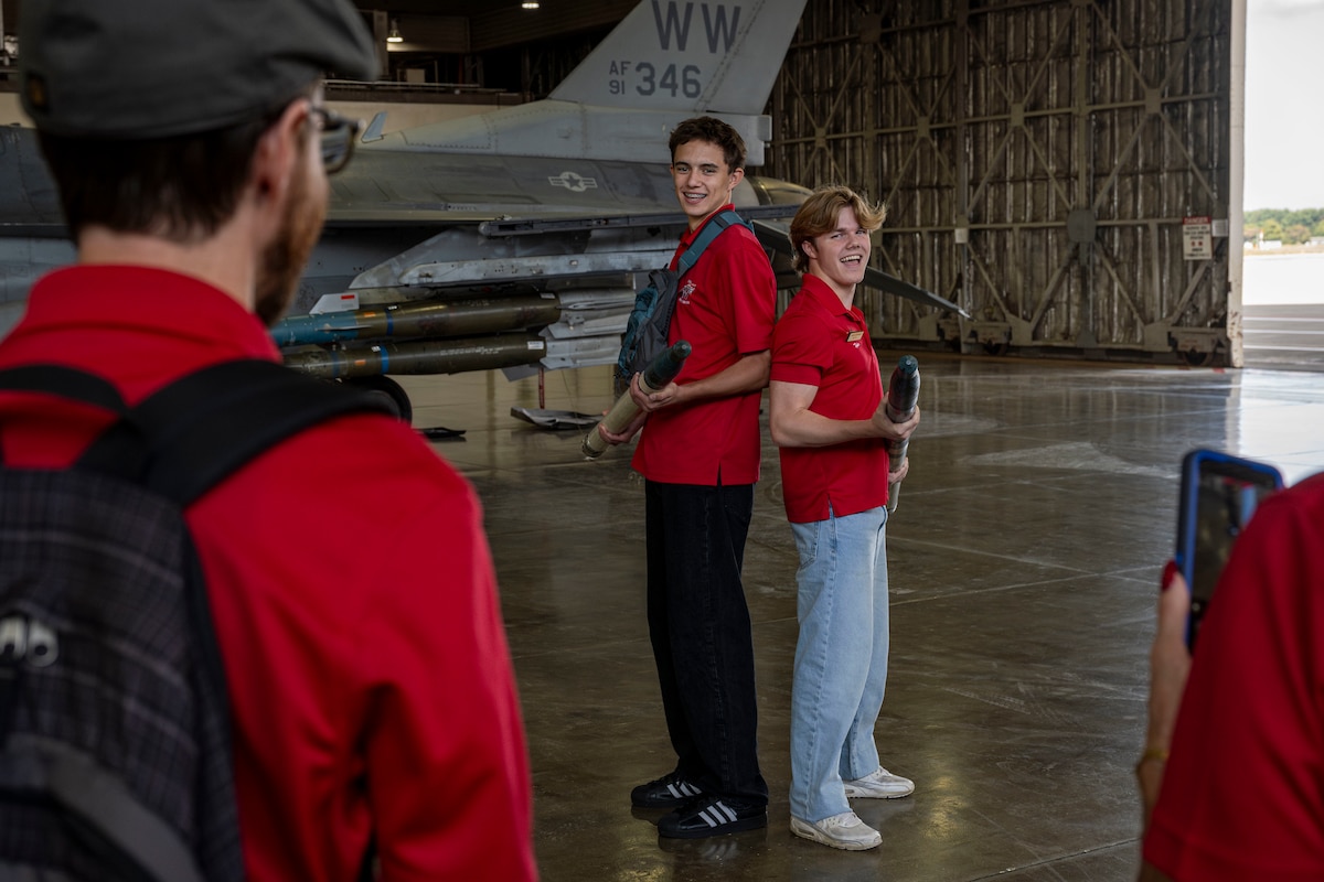 Members of the Wenatchee Valley, Washington sister city delegation pose with F-16 Fighting Falcon rockets at Misawa Air Base, Japan, Oct. 3, 2025. Sharing the base’s mission and operations with the sister-city delegation fostered transparency and partnership, strengthening public awareness of the wing’s role in maintaining readiness. (U.S. Air Force photo by Senior Airman Patrick Boyle)