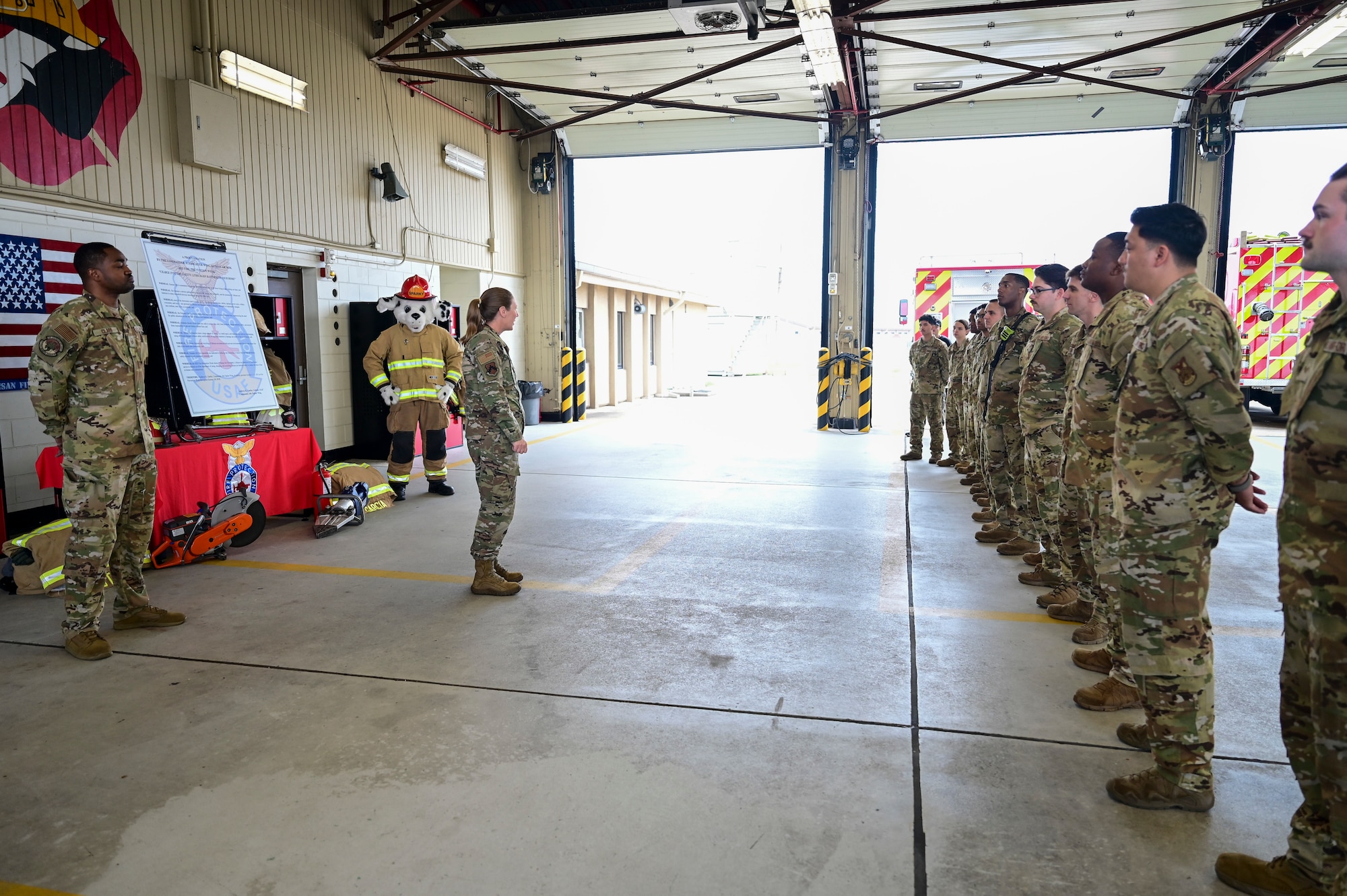 A woman speaks to a group of people.