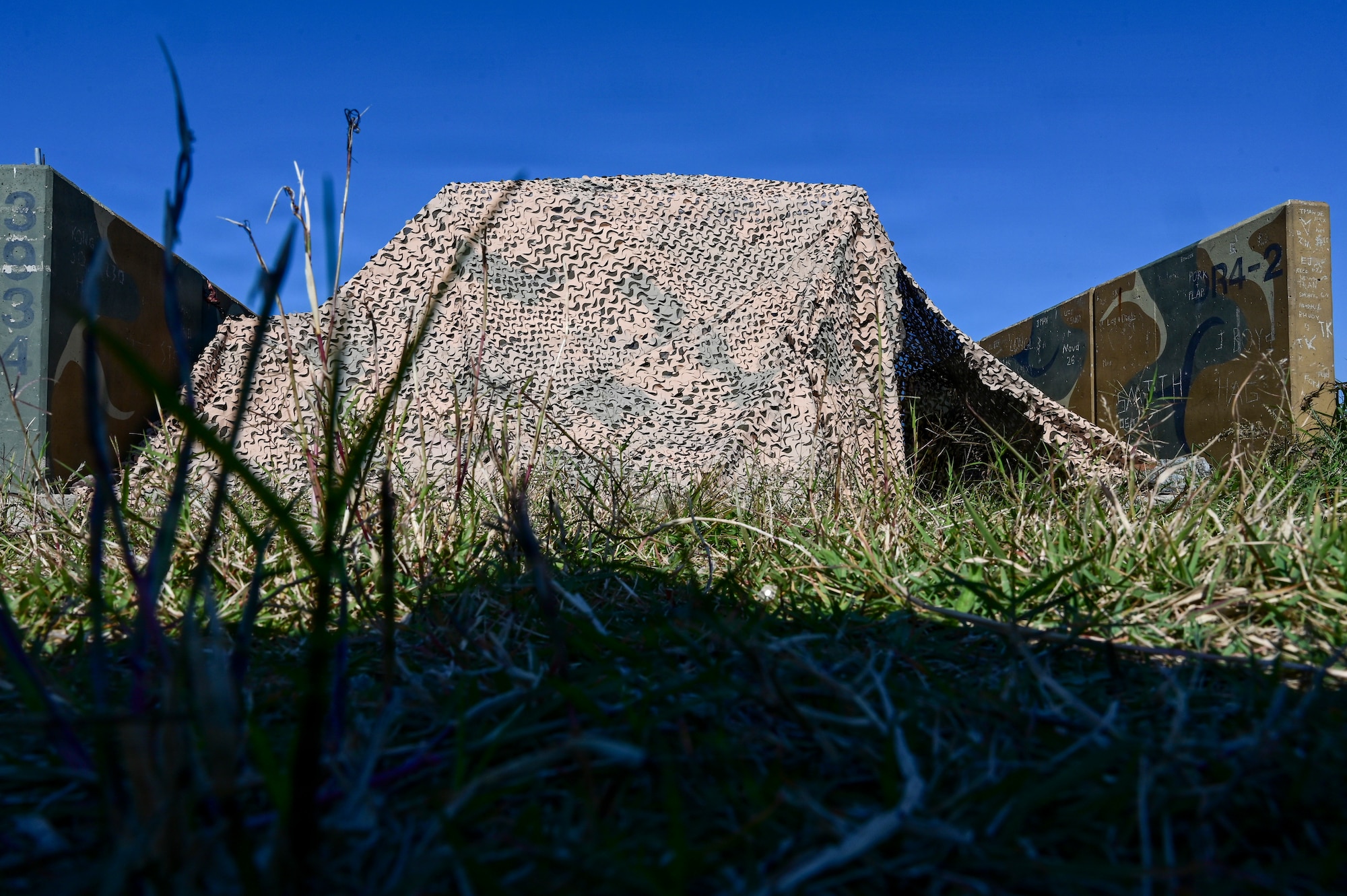 A tent sits on a hill.