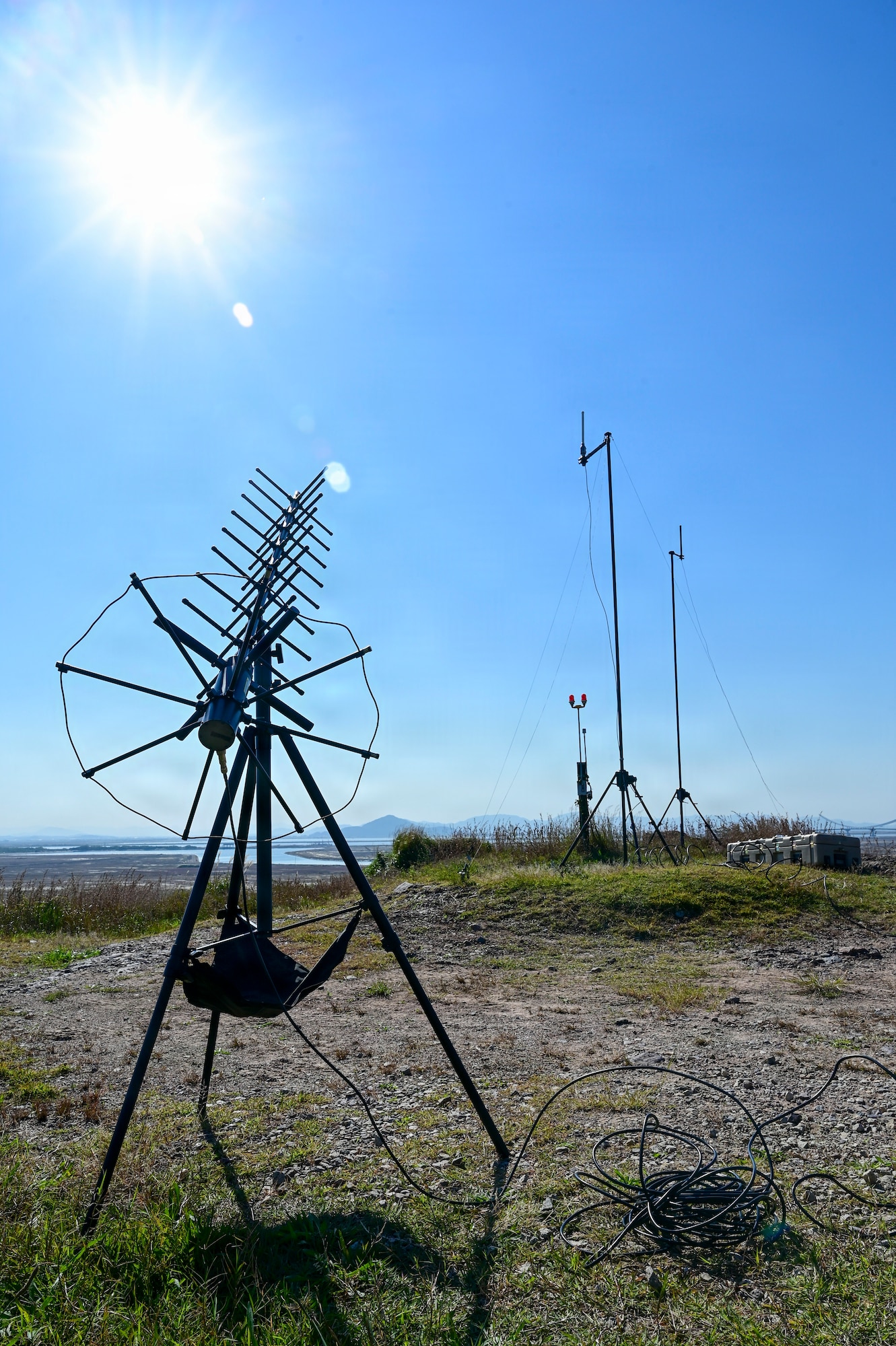 An antenna sits on a hill.