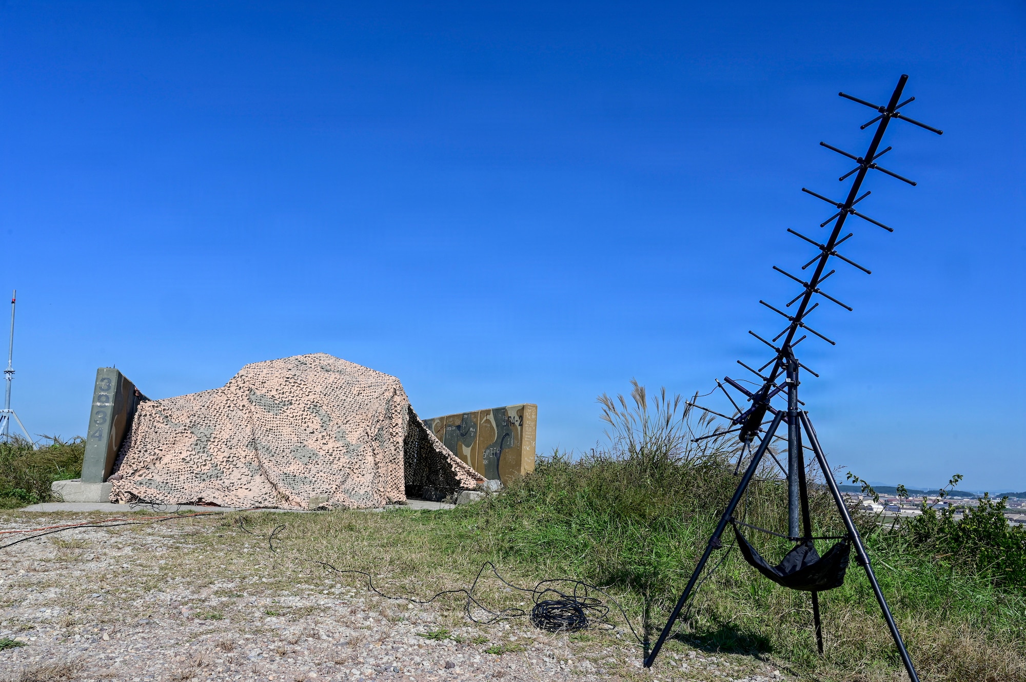 A tent sits on a hill.
