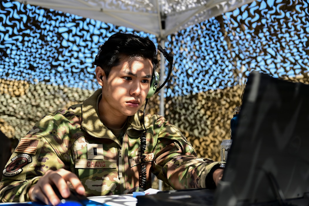 A man works on a computer.