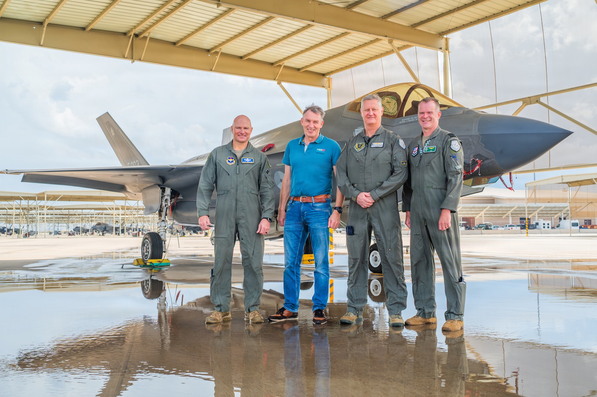 U.S. Air Force Brig. Gen. David Berkland (left), 56th Fighter Wing commander, Royal Netherlands Air and Space Force Brig. Gen. Peter Tankink (center left), Joint Force Command Brunssum assistant chief of staff, Brig. Gen. Marcel van Egmond (center right), RNLASF Air Combat Command commander, and Lt. Col. Joseph Luijsterburg (right), 308th Fighter Squadron Dutch detachment commander, stand in front of an F-35A Lightning II on the flightline during a base visit