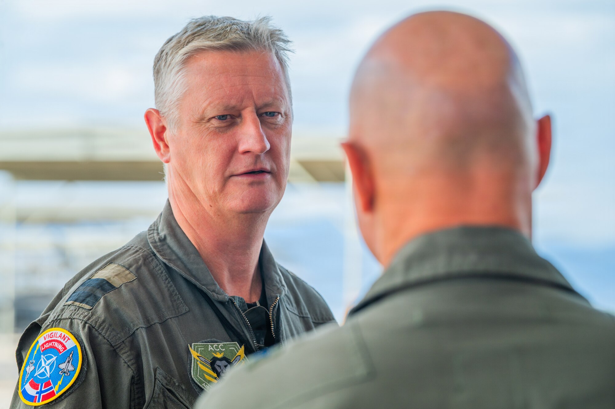 Royal Netherlands Air and Space Force Brig. Gen. Marcel van Egmond (left), RNLASF Air Combat Command commander, speaks with U.S. Air Force Brig. Gen. David Berkland (right), 56th Fighter Wing commander, during a base visit