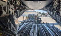 Airmen with the 752nd Operations Support Squadron unload the Tactical Operations Center – Light kit from a U.S. aircraft here, July 25, 2025. The TOC-L is a mobile, scalable node that fuses data from multiple sources to build a synchronized air picture, enabling faster and more accurate decision-making. Its development supports the evolving DAF BATTLE NETWORK, which connects sensors, effectors, and logistics systems across domains. (Courtesy Photo)