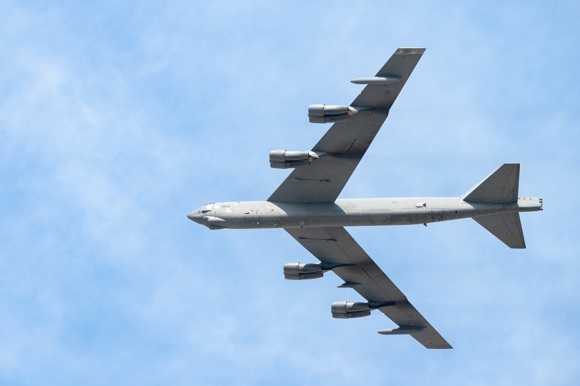 A U.S. Air Force B-52 Stratofortress aircraft, assigned to the 96th Bomb Squadron from Barksdale Air Force Base, Louisiana, flies over spectators at the Dubai Airshow 2025, Nov. 17, 2025, at the Al Maktoum International Airport in Dubai, United Arab Emirates. The B-52 flew from Rota, Spain, to participate in the event, showcasing U.S. airpower on a global stage. (U.S. Air Force photo by Staff Sgt. Tylin Rust)