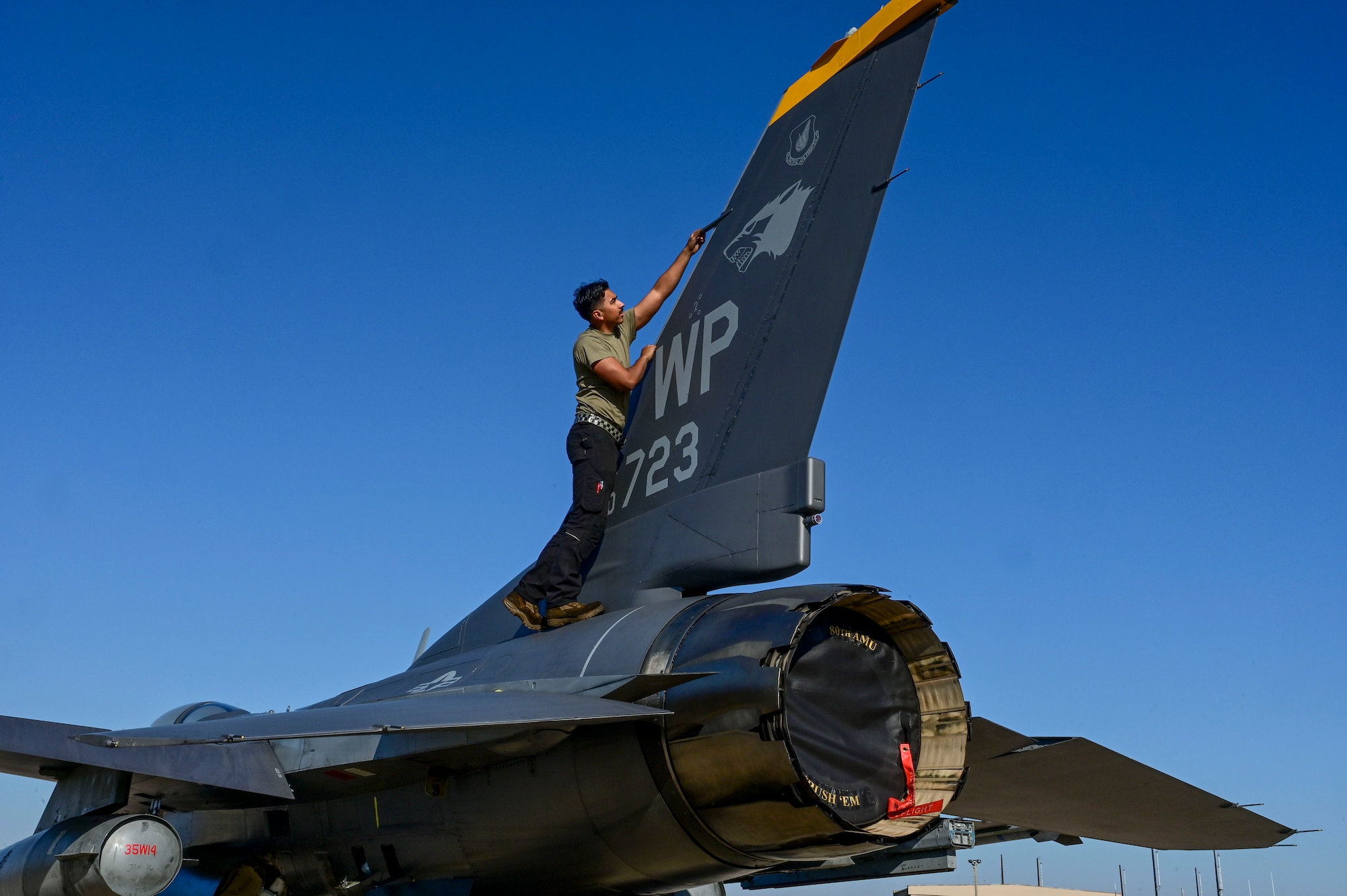 A man works on a tail flash.