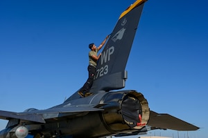 A man works on a tail flash.