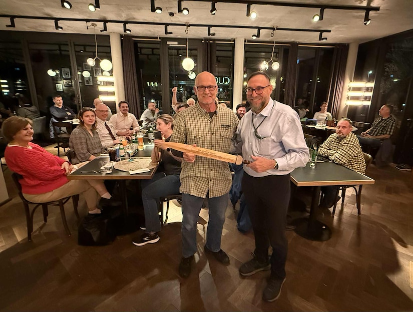 The 405th Army Field Support Brigade hosted a farewell dinner for Herb Gately Nov. 17 in honor of his dedicated service and exceptional work supporting the brigade as a program analyst in the Contract Management Support Office since August 2024. Gately (pictured here on left) also served with the 405th AFSB’s Germany Battalion at the Coleman Army Prepositioned Stocks-2 worksite from March 2022 until August 2024 to include director of the APS-2 worksite for over a year. (U.S. Army courtesy photo)