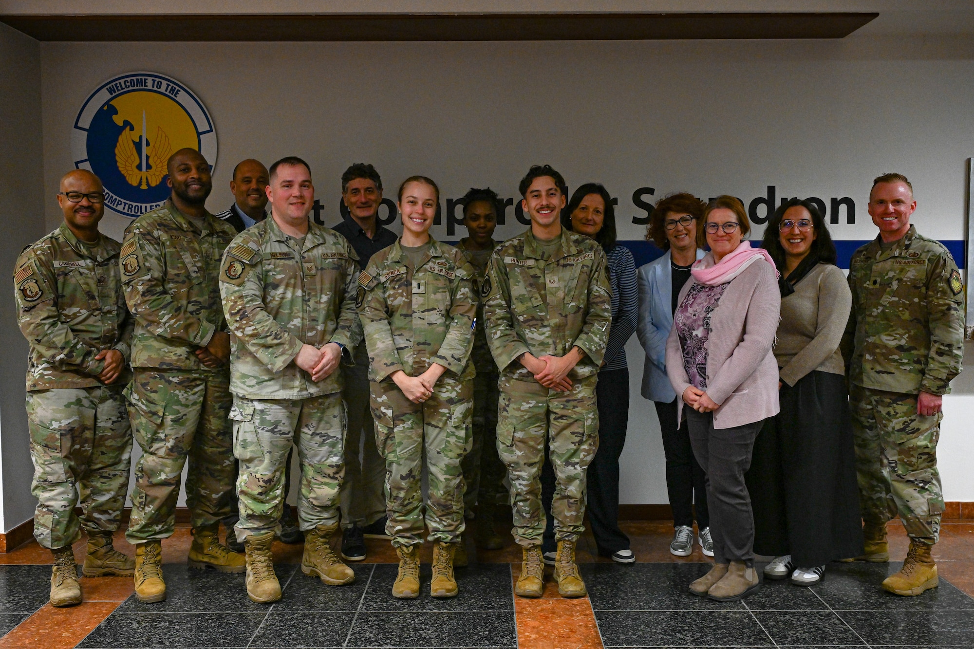 People take a group photo.
