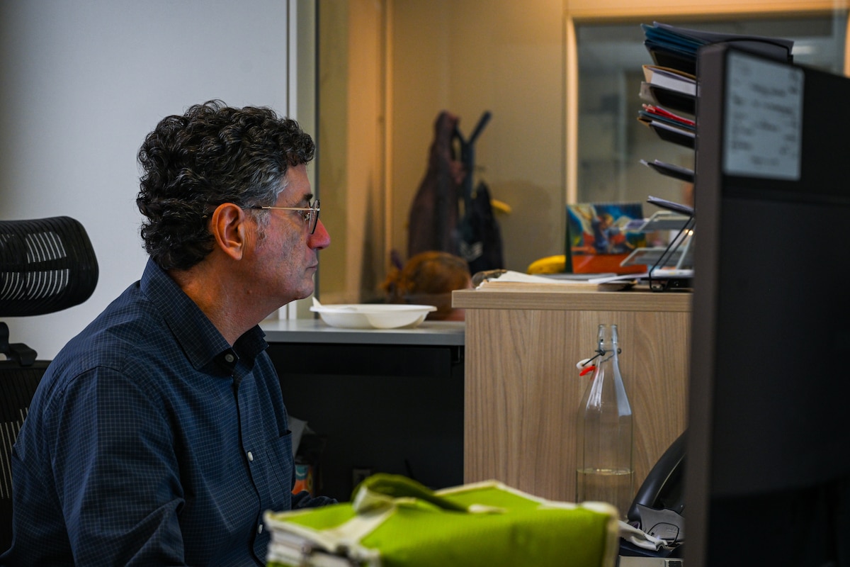 A man looks at his computer.