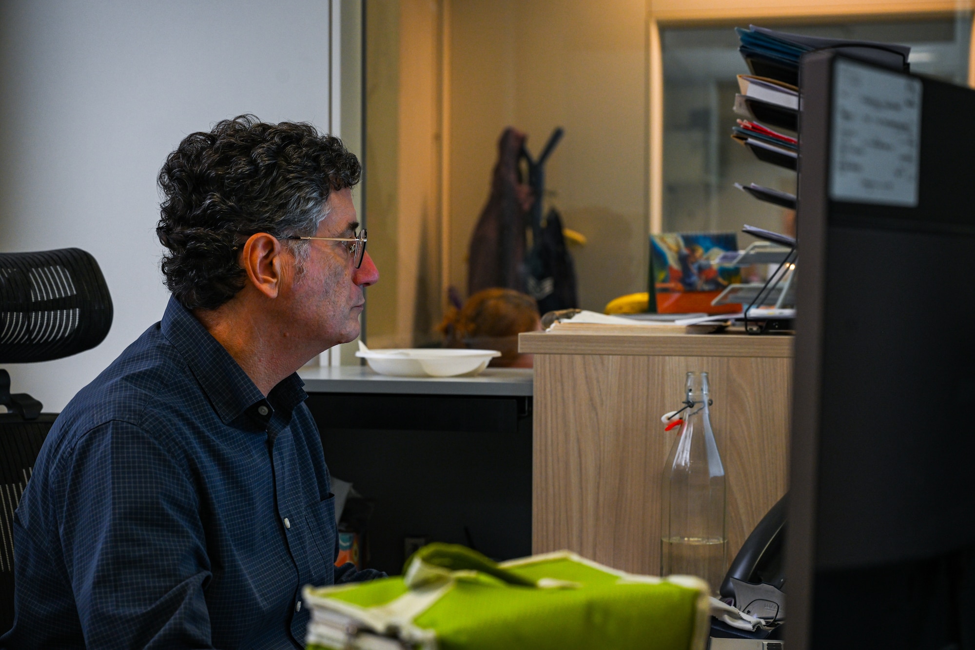 A man looks at his computer.