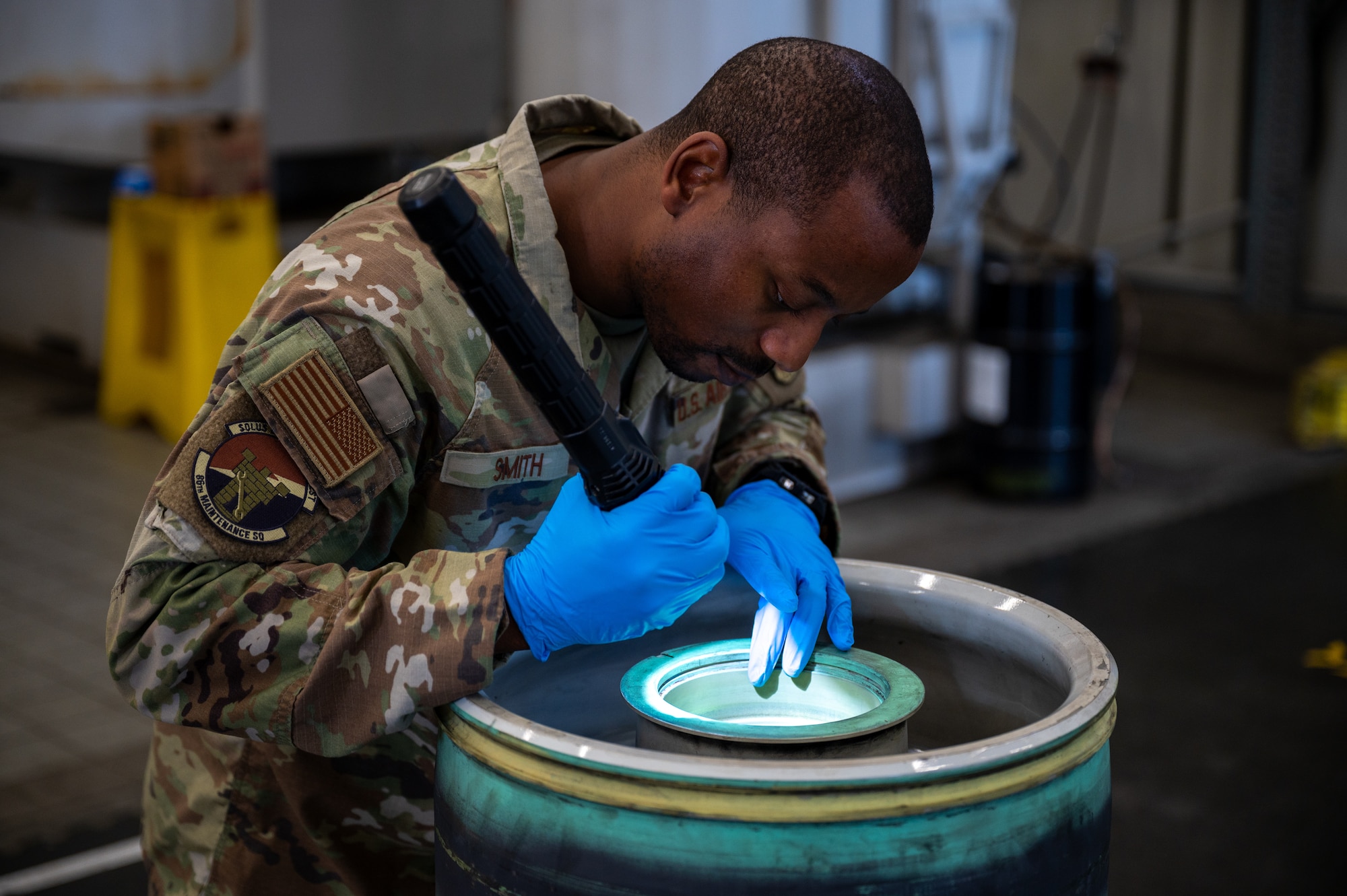 U.S. Air Force Tech. Sgt. Christopher Smith, 86th Maintenance Squadron noncommissioned officer in charge of the Wheel and Tire Shop, inspects a C-130J Super Hercules main wheel at Ramstein Air Base, Germany, Oct. 1, 2025. The precise work of the Wheel and Tire Shop supports the 86th Airlift Wing’s ability to launch aircraft safely and on time. (U.S. Air Force photo by Senior Airman Jared Lovett)