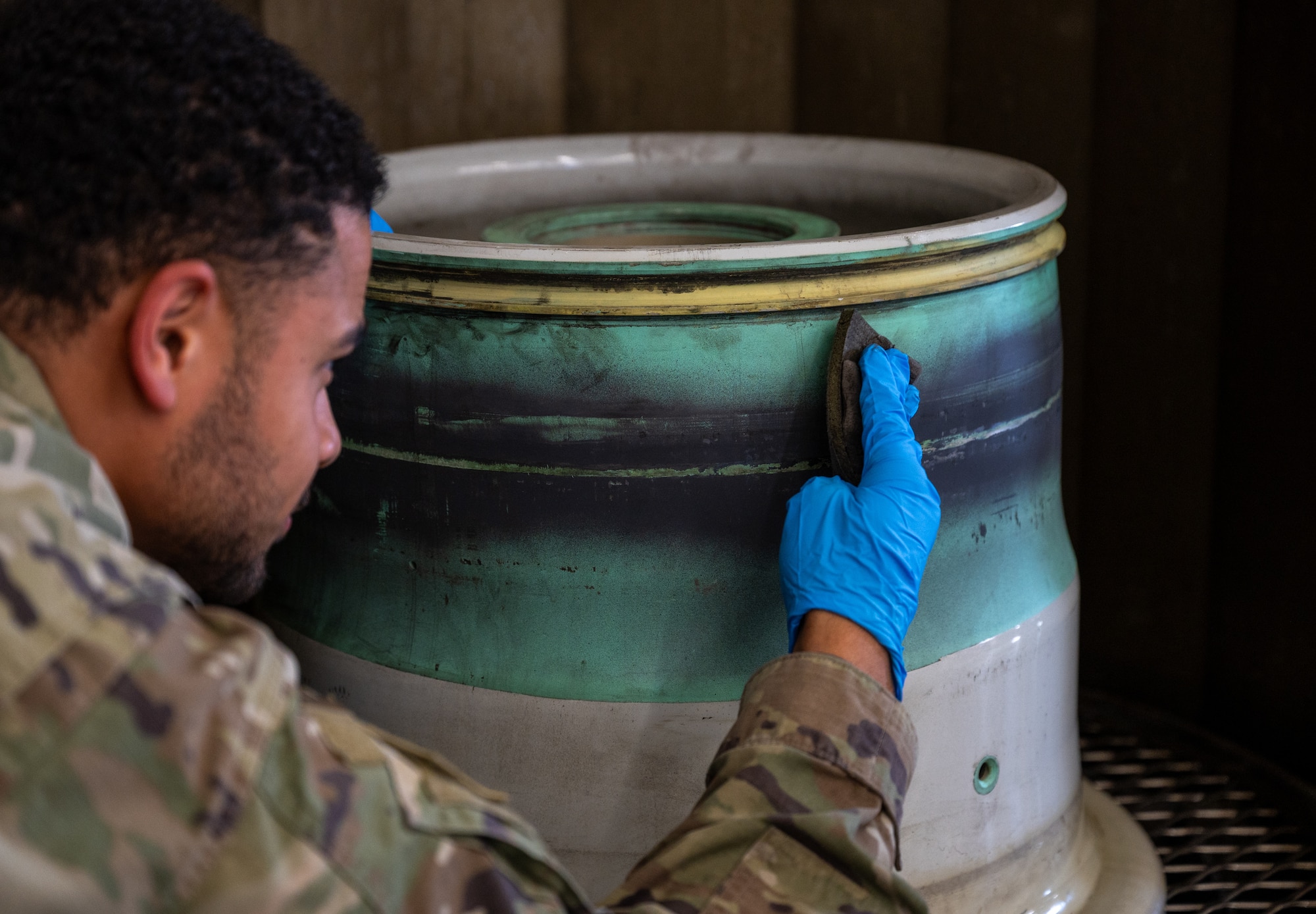 U.S. Air Force Senior Airman Montez Bell, 86th Maintenance Squadron repair and reclamation journeyman, cleans a C-130J Super Hercules main wheel at Ramstein Air Base, Germany, Oct. 1, 2025. With only four personnel, the Wheel and Tire Shop repairs an average of 136 C-130J wheels each year. (U.S. Air Force photo by Senior Airman Jared Lovett)