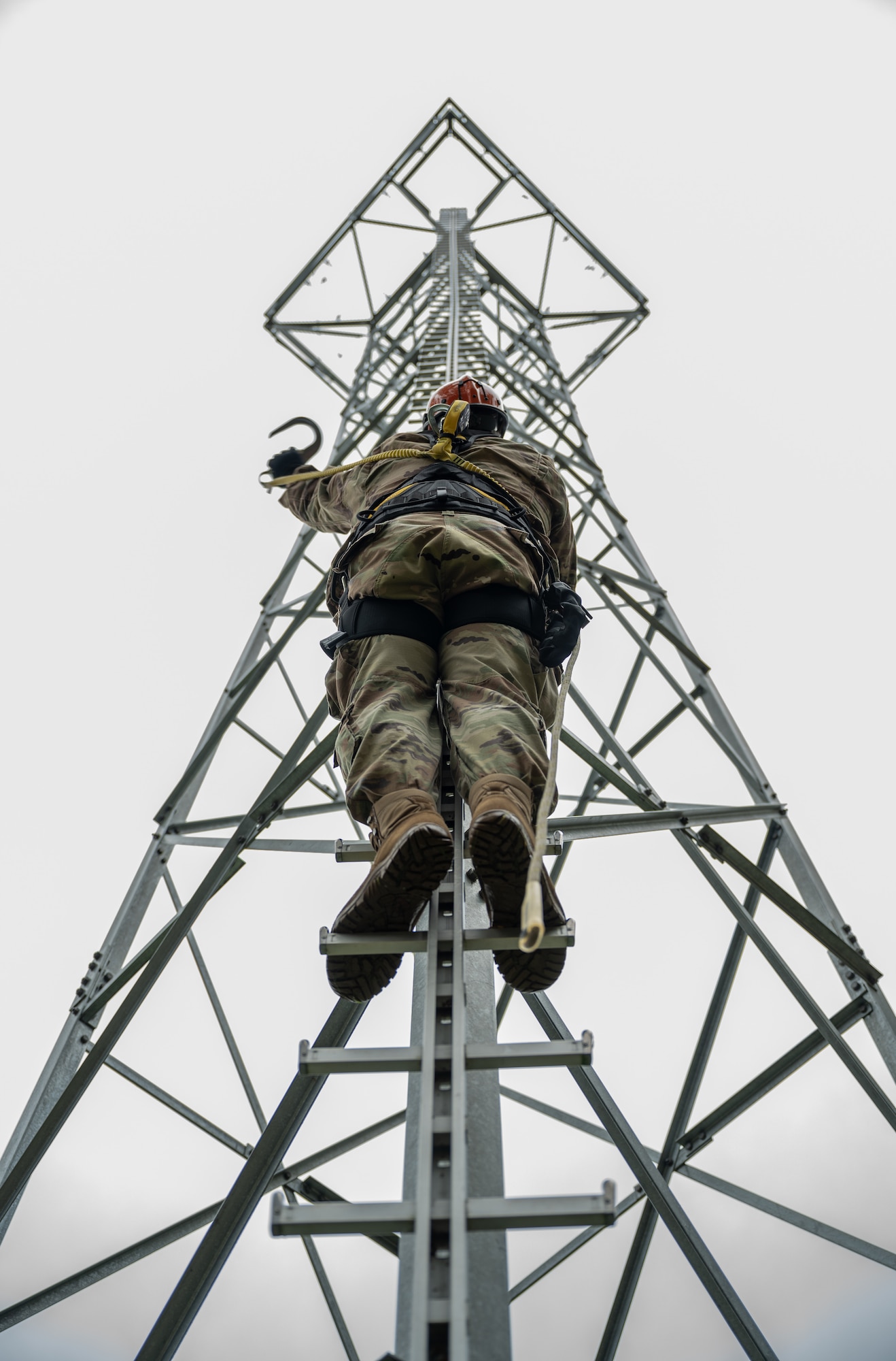 U.S. Air Force Staff Sgt. Caleb Archer, European Regional Maintenance Center technician, provides members of the Deployed Regional Maintenance Center with tower climbing training at Kapaun Air Station, Germany, Oct. 9, 2025. The ERMC provides 24/7 technical support for 118 airfields, ensuring critical navigation systems remain operational across Europe and Africa. (U.S. Air Force photo by Senior Airman Jared Lovett)