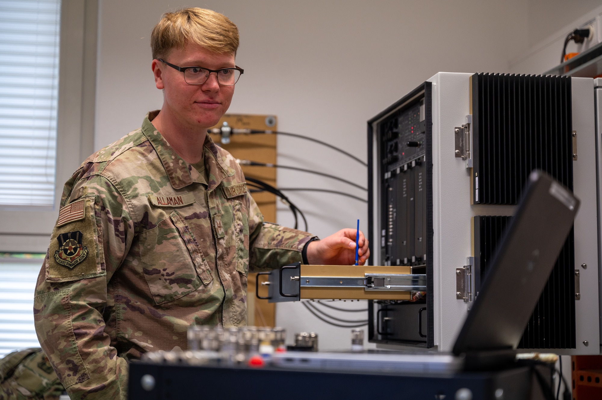 U.S. Air Force Staff Sgt. James Allaman, European Regional Maintenance Center technician, performs an alignment on a navigational aid at Kapaun Air Station, Germany, Oct. 9, 2025. The ERMC consists of 17 Airmen who specialize in maintaining and troubleshooting radar, airfield and weather systems that enable safe aircraft landings in any condition. (U.S. Air Force photo by Senior Airman Jared Lovett)