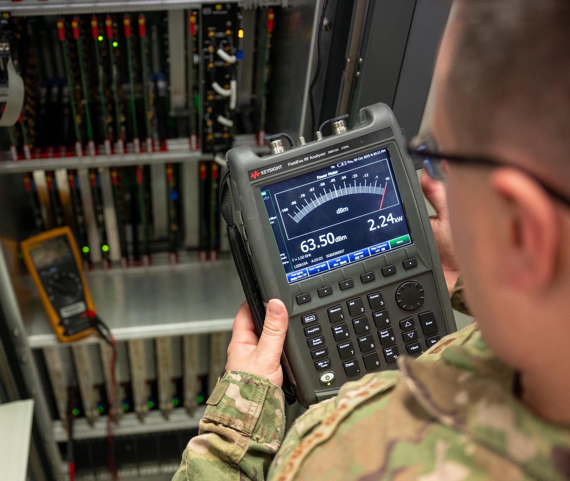 U.S. Air Force Tech. Sgt. Christian Wilson, European Regional Maintenance Center team chief, checks for the correct output power of a Tactical Air Navigation System at Kapaun Air Station, Germany, Oct. 9, 2025. The ERMC team enables airfields to recover quickly from equipment failures, minimizing downtime and maintaining flight safety. (U.S. Air Force photo by Senior Airman Jared Lovett)