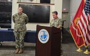 U.S Navy Captain Samantha Dutily, Chief of Staff at the Navy Warfare Development Center, addresses sailors, civilians, and contractors as they come together to celebrate the U.S. Navy's 250th birthday, reflecting on its rich history and the contributions of all who serve.