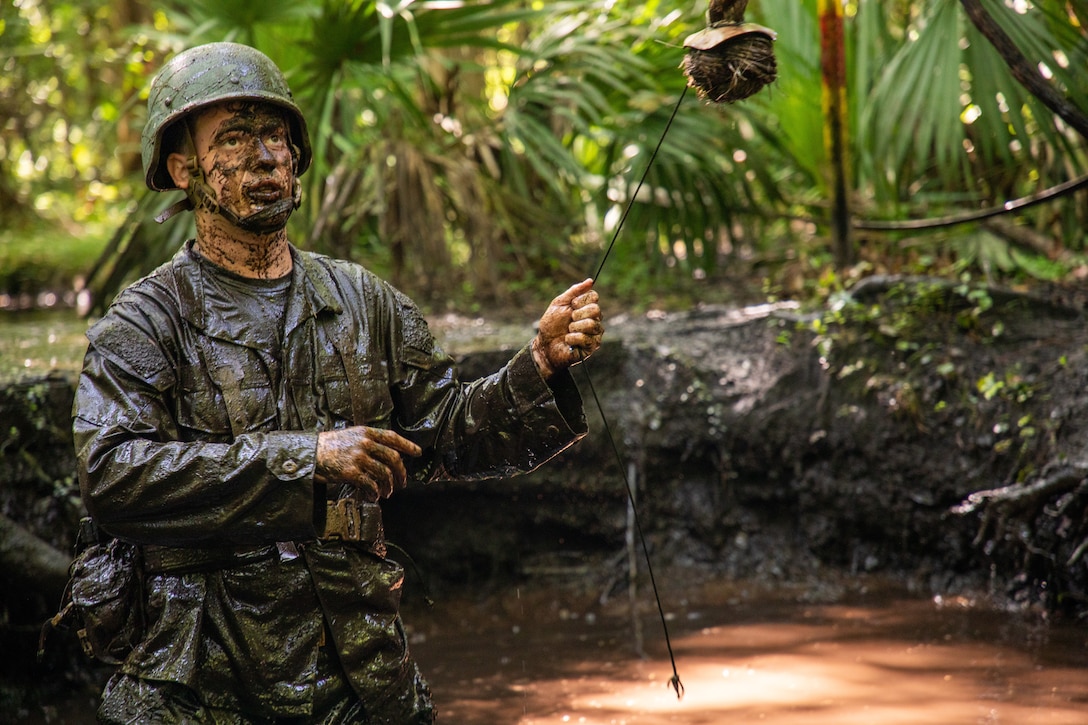 A U.S. Naval Academy Student participates in an endurance course on Marine Corps Base Camp Lejeune, North Carolina, July 8, 2025. The 24th Marine Expeditionary Unit (MEU) partners with the U.S. Naval Academy to optimize the future force with the annual Professional Training of Midshipmen (PROTRAMID) and Career Orientation and Training of Midshipmen (CORTRAMID) program. The PROTRAMID and CORTRAMID immerses midshipmen in multiple facets of rigorous training all Marines endure. Most of these Midshipmen will soon be Junior Officers in U.S. Marines, or the U.S. Navy, depending on their service designation. (U.S. Marine Corps photo by Cpl. Victoria Hutt)