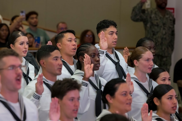 Hospitalman Jaylen Rico stands with his fellow Hospital Corpsman Basic Program Class 190-25 graduates reciting the Corpsman Pledge during their graduation ceremony at Joint Base San Antonio - Fort Sam Houston, Texas, Oct. 07, 2025. Rico is now the fourth generation of his family to serve in the Navy, and joins his mother, father, stepfather and grandfather as a Hospital Corpsman. (U.S. Navy photo by Malcolm McClendon)