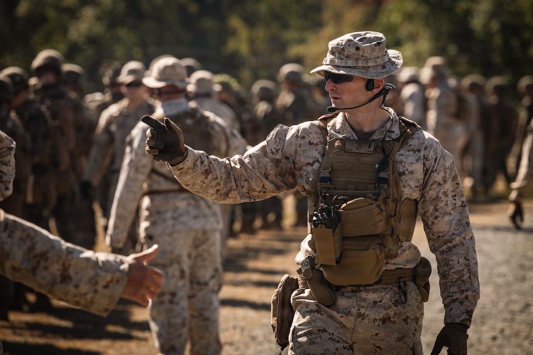 U.S. Marine Corps 1st Lt. John Rega, a field artillery officer and staff platoon commander with Company D, Basic Officer Course 4-25, The Basic School, conducts a head count of Marines at the end of a dry-fire run of a Field Firing Exercise on Marine Corps Base Quantico, Virginia, Oct. 10, 2025. The FFEX provided students the opportunity to refine their skills in conducting a live-fire assault on a target with support-by-fire and maneuver elements. (U.S. Marine Corps photo by Cpl. Joshua Barker)