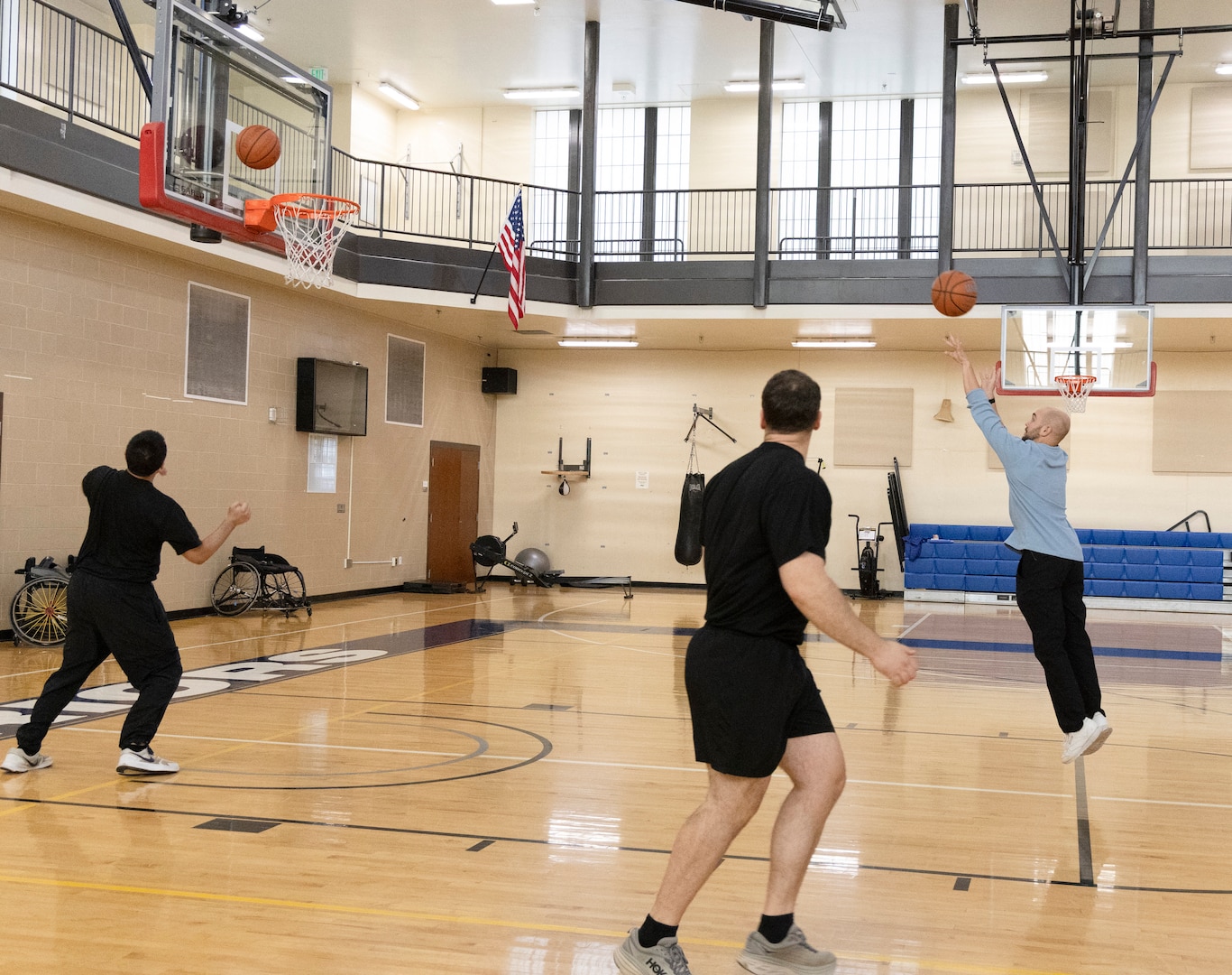 Staff and Soldiers shoot hoops at an adaptive reconditioning event for the Walter Reed Soldier Recovery Brigade. The unit has an adaptive reconditioning program that helps Soldiers in their recovery and transition. (DOW photo by Ann Brandstadter)