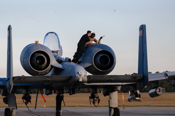 U.S. Air Force Airmen perform maintenance on an A-10C Thunderbolt II during exercise Mosaic Tiger 26-1 at Moody Air Force Base, Ga., Nov. 17, 2025. The exercise strengthens Agile Combat Employment capabilities by training maintainers to sustain aircraft operations with limited resources in contested environments. (U.S. Air Force photo by Senior Airman Iain Stanley)