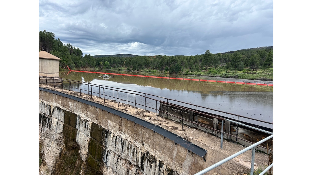 Debris runoff from a storm event is seen in Peterson Reservoir in this photo taken during an inspection of the dam and reservoir, June 23, 2024. The City of Las Vegas, N.M., uses water from the reservoir for municipal purposes. The watershed area was affected by the 2022 Calf Canyon/Hermits Peak Fire. Photo by Chris Carroll.
