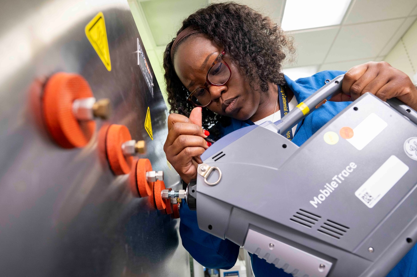 Ashley Fulton, Ph.D., U.S. Naval Research Laboratory research chemist, uses an ion mobility spectrometer to test a vapor generated from a trace explosive sensor testbed in Washington, D.C., Nov. 12, 2025. Fulton’s research explores the development of non-contact fentanyl detection to increase the safety of first responders. (U.S. Navy photo by Sarah Peterson)