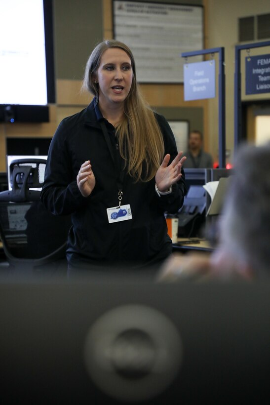 U.S. Army Capt. Kelli Ryan, cyber exercise planning officer, speaks to the Soldiers and civilians taking part in Cyber Bluegrass at the Emergency Operations Center on Boone National Guard Center in Frankfort, Ky., Nov. 4, 2025.