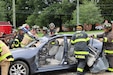 Members of the fire department demonstrate an emergency car rescue.
