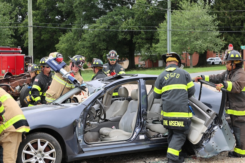 Members of the fire department demonstrate an emergency car rescue.