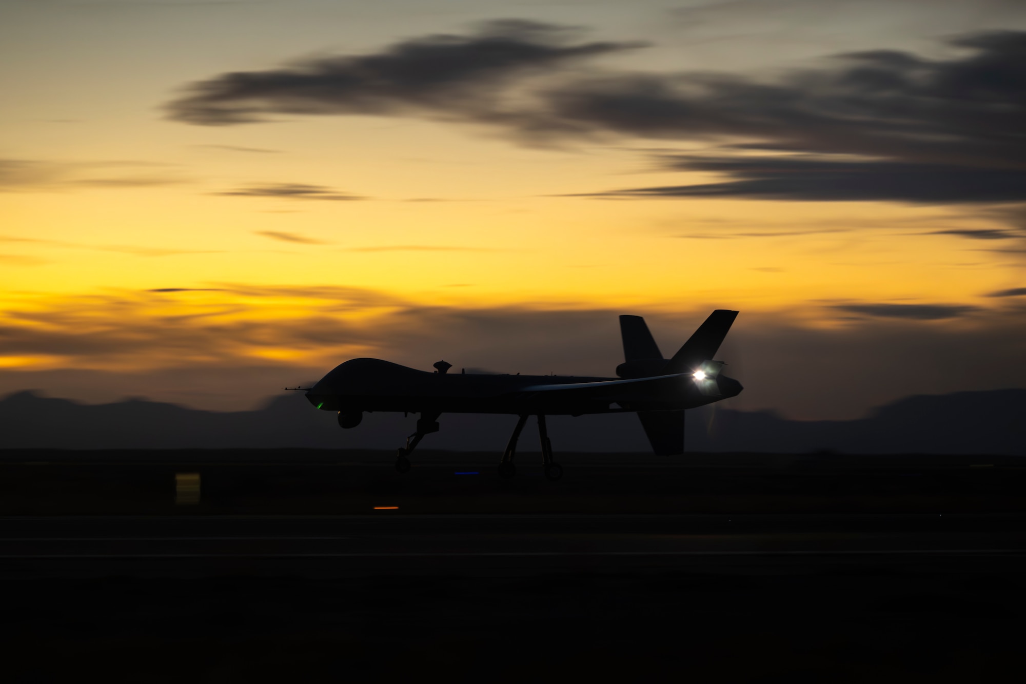 An MQ-9 Reaper assigned to the 49th Operations Group lands after completing a training sortie at Holloman Air Force Base, New Mexico, Nov. 13, 2025. The 49th OG is responsible for training the majority of the Air Force’s MQ-9 pilots and sensor operators in addition to assisting other branches, such as the U.S. Marine Corps, and NATO allies with their own Reaper training programs. (U.S. Air Force photo by Tech. Sgt. Victor J. Caputo)