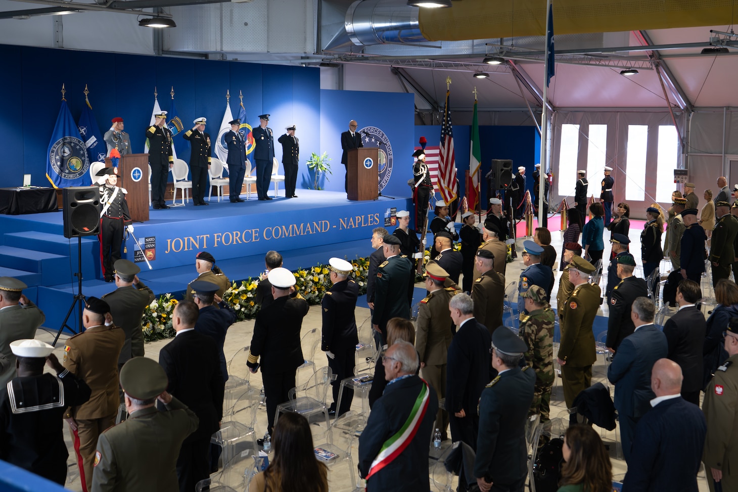 Adm. George M. Wikoff, Commander, U.S. Naval Forces Europe and Africa (NAVEUR/NAVAF), center,  and official party render a solute during a change of command ceremony held at Allied Joint Force Command (JFC) Naples, Nov. 19, 2025. For more than 80 years, NAVEUR/NAVAF has forged strategic relationships with Allies and partners, leveraging a foundation of shared values to share the duties of preserving security and stability. (U.S. Army photo by Master Sergeant Ryan Hohman)
