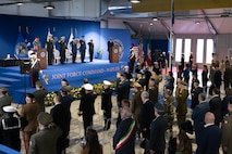 Adm. George M. Wikoff, Commander, U.S. Naval Forces Europe and Africa (NAVEUR/NAVAF), center,  and official party render a solute during a change of command ceremony held at Allied Joint Force Command (JFC) Naples, Nov. 19, 2025. For more than 80 years, NAVEUR/NAVAF has forged strategic relationships with Allies and partners, leveraging a foundation of shared values to share the duties of preserving security and stability. (U.S. Army photo by Master Sergeant Ryan Hohman)