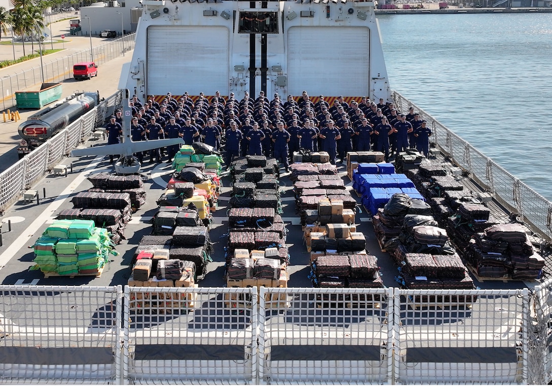 Coast Guard Cutter Stone's crew poses for a group photo on the flight deck of the ship on Nov. 18, 2025, Port Everglades, Florida. Coast Guard Cutter Stone’s crew offloaded approximately 49,010 pounds of illicit narcotics worth more than $362 million. (U.S. Coast Guard photo by Cutter Stone's crew)