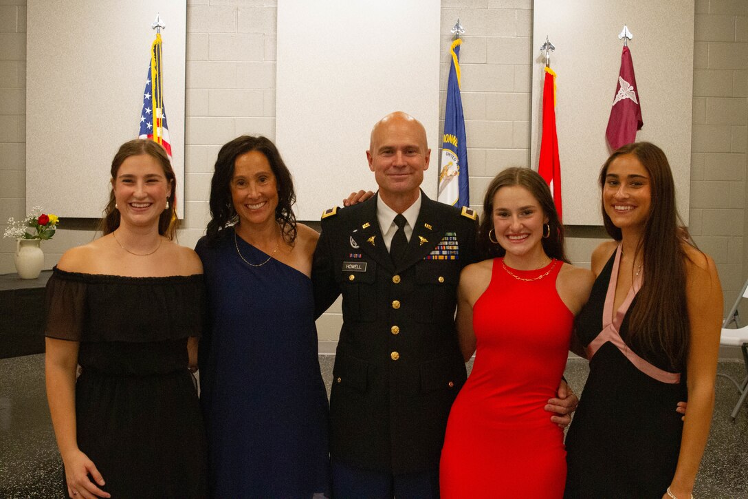 U.S. Army Col. Christopher Howell celebrates with his family after his retirement ceremony in Frankfort, Ky., Oct. 18, 2025.