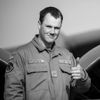 Airman 1st Class Sean Cauthen, 23rd Bomber Generation Squadron crew chief, gives a thumbs-up as part of Exercise Global Thunder 26 at Minot Air Force Base, North Dakota, Oct. 19, 2025. Global Thunder is an annual command and control exercise designed to train U.S. Strategic Command forces and assess joint operational readiness. (U.S. Air Force photo by Senior Airman Kyle Wilson)