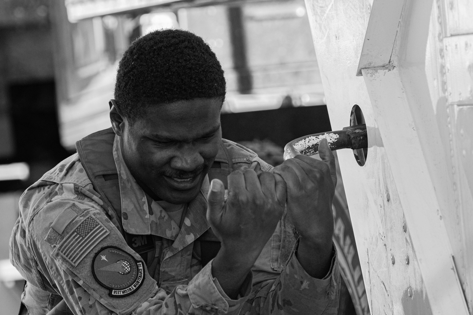 Senior Airman Christoper Ray, 91st Missile Maintenance Squadron top side maintainer, conducts maintenance operations as part of Exercise Global Thunder 26 near Minot Air Force Base, North Dakota, Oct. 23, 2025. Global Thunder is an annual command and control exercise designed to train U.S. Strategic Command forces and assess joint operational readiness. (U.S. Air Force photo by Airman 1st Class Vincent Padilla)