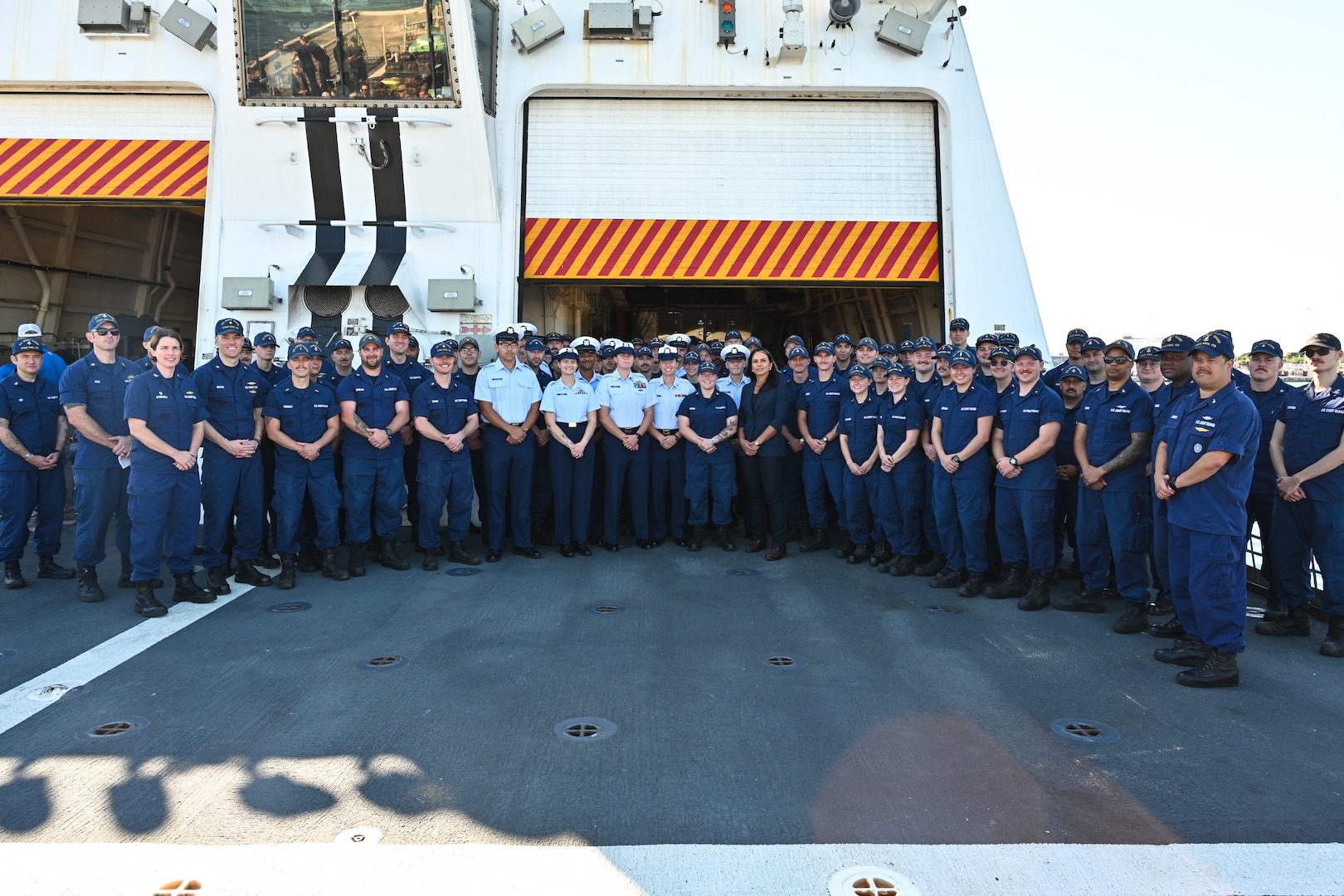 Tulsi Gabbard, National Intelligence director, poses for a photo with the crew of Coast Guard Cutter Stone (WMSL 758) during a drug offload at Port Everglades in Fort Lauderdale, Florida, Nov. 19, 205. Stone’s crew offloaded approximately 49,010 pounds of illicit narcotics worth more than $362 million. (U.S. Coast Guard photo by Petty Officer 2nd Class Brandon Hillard)
