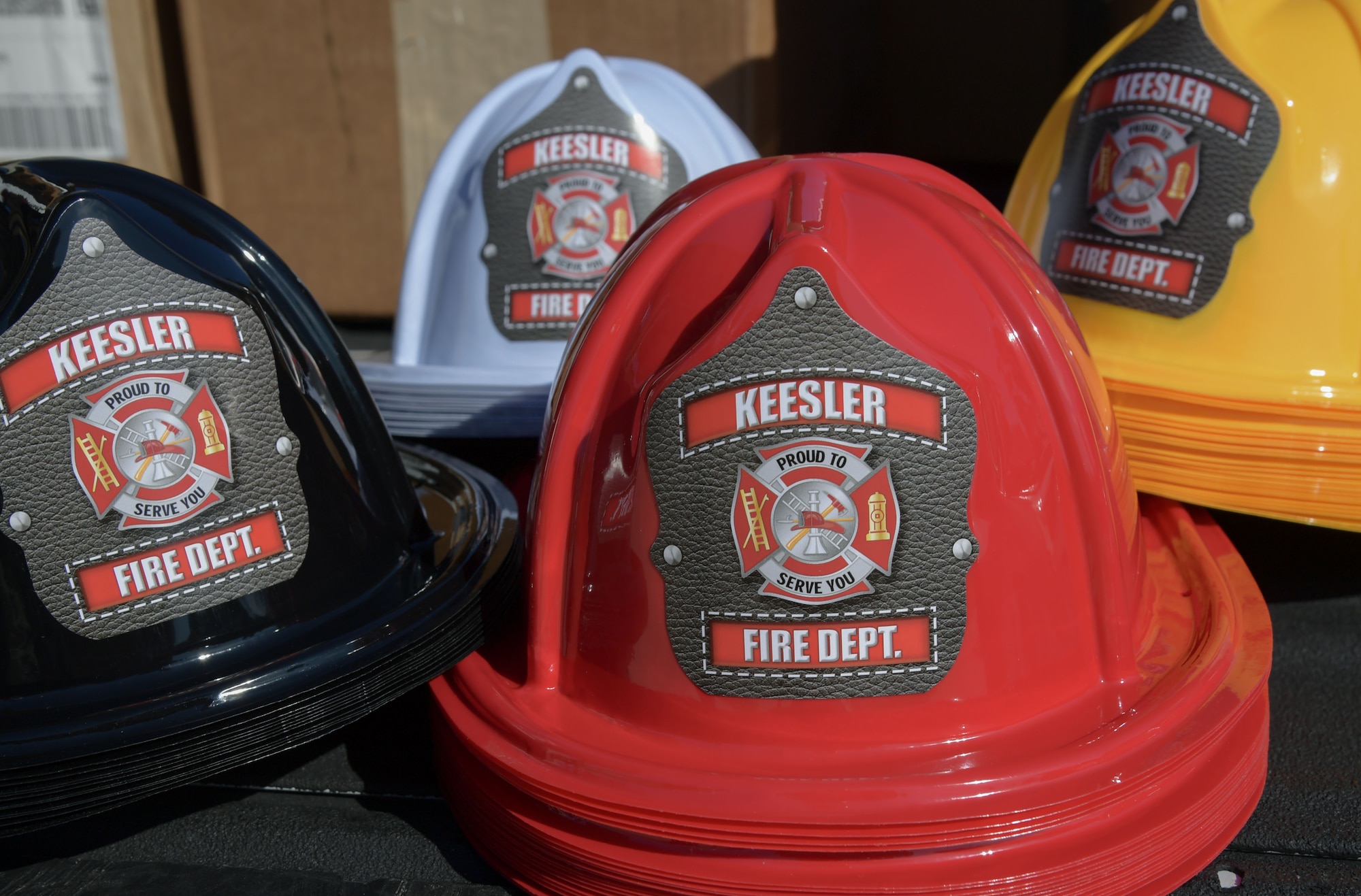 Colorful toy fire hats are on display