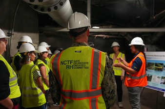 The community planning liaison officer, Navy Closure Task Force-Red Hill (NCTF-RH) provides a brief to University of Hawaii Red Hill Registry members during a site visit to the Red Hill Bulk Fuel Storage Facility (RHBFSF) in Honolulu, Sept. 26, 2025.  Charged with the safe decommissioning of the RHBFSF, NCTF-RH was established by the Department of the Navy as a commitment to the community and the environment. NCTF-RH continues to engage with the people of Hawaii, regulatory agencies, and other stakeholders as it safely and deliberately decommissions the facility. (U.S. Navy photo by Mass Communication Specialist 3rd Class Krystal Diaz)