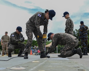 Republic of Korea Air Force airmen use the tools provided to finish their tasks.