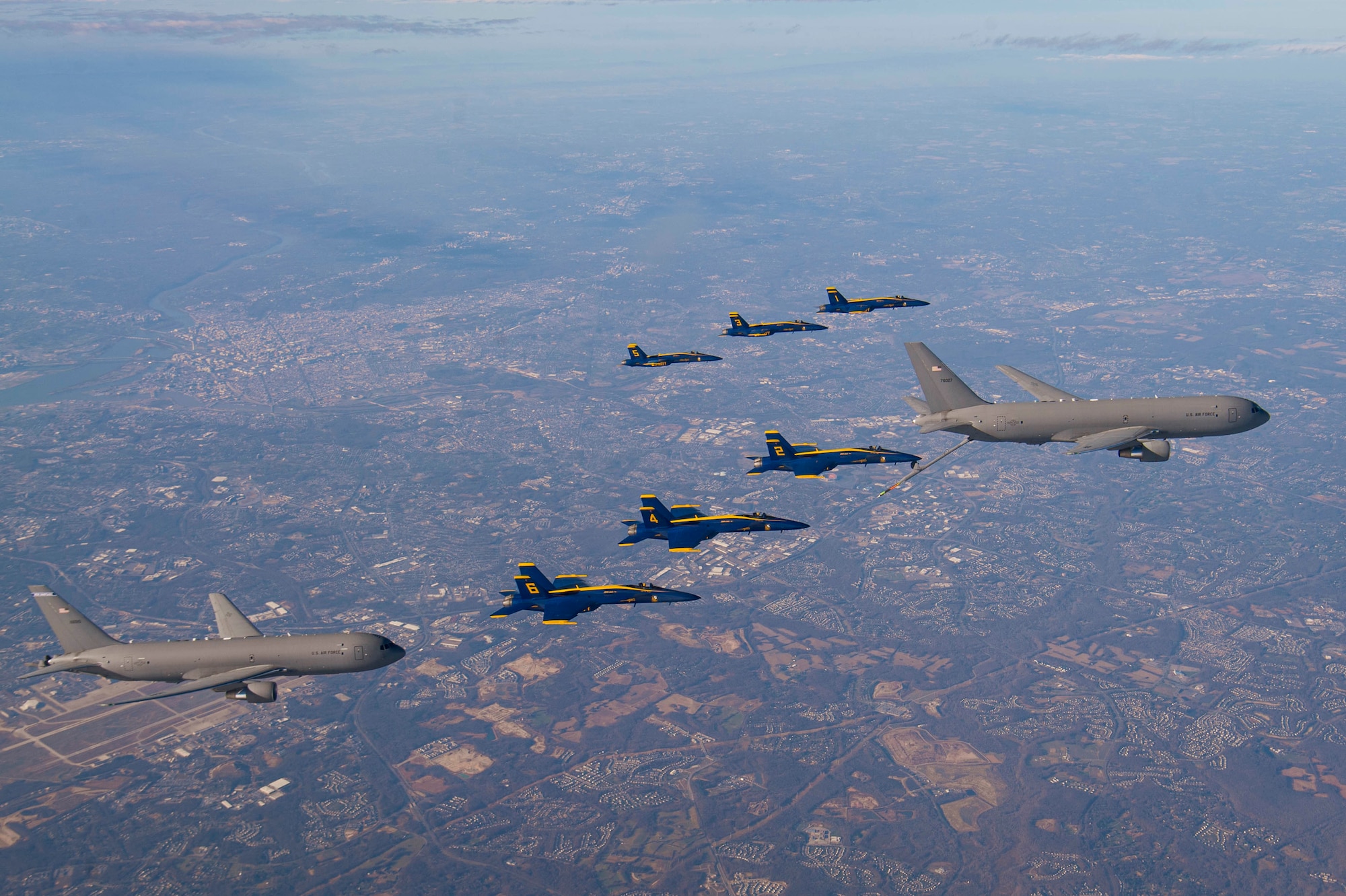 U.S. Navy Flight Demonstration Squadron, the Blue Angels, and two U.S. Air Force KC-46 aircraft assigned to the 157th Air Refueling Wing, New Hampshire National Guard and 22nd Air Refueling Wing, fly in formation during a refueling evolution while in transit for the 2020 Army-Navy Game.