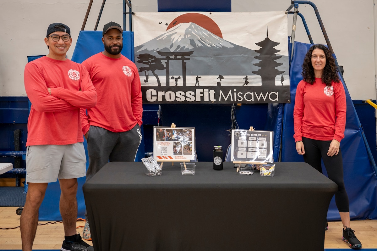 Members of CrossFit Misawa pose for a group photo during the 2025 Health & Wellness Expo at Misawa Air Base, Japan, Nov. 14, 2025. The event advances Misawa AB’s readiness objectives by connecting Airmen with resources that bolster their overall resilience. (U.S. Air Force photo by Senior Airman Brittany Russell)