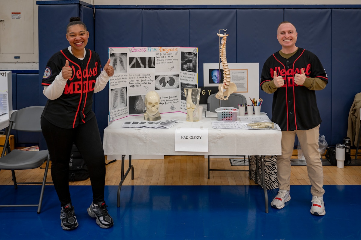 U.S. Airmen assigned to the 35th Medical Group pose for a photo during the 2025 Health & Wellness Expo at Misawa Air Base, Japan, Nov. 14, 2025. The event fostered collaboration and connection by bringing members together to learn through hands-on demonstrations.. (U.S. Air Force photo by Senior Airman Brittany Russell)