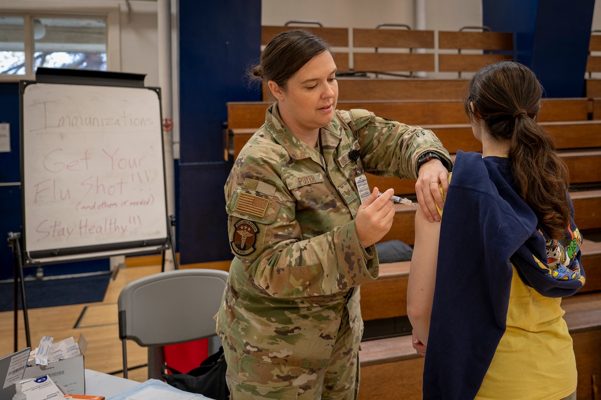 A U.S. Air Force Airman assigned to the 35th Medical Group administers a flu shot during the 2025 Health & Wellness Expo at Misawa Air Base, Japan, Nov. 14, 2025. Initiatives like the expo demonstrate the 35th Fighter Wing’s commitment to keeping Airmen protected, prepared, and mission ready. (U.S. Air Force photo by Senior Airman Brittany Russell)