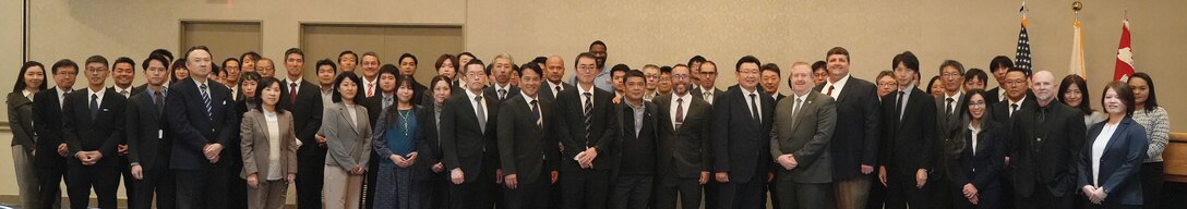 Members of the U.S. Army Corps of Engineers – Japan Engineer District (USACE JED) Engineering Division and the Japanese Ministry of Defense (MoD) Engineering Facilities Group pose for a photo before the opening of a technical forum held at Camp Zama, Japan, on November 18, 2025. This event marked the 27th year of this important collaboration and the second annual meeting between U.S. and Japanese defense engineers following disruptions caused by the COVID-19 pandemic. The forum brought together approximately 75 engineers and architects from both organizations.
